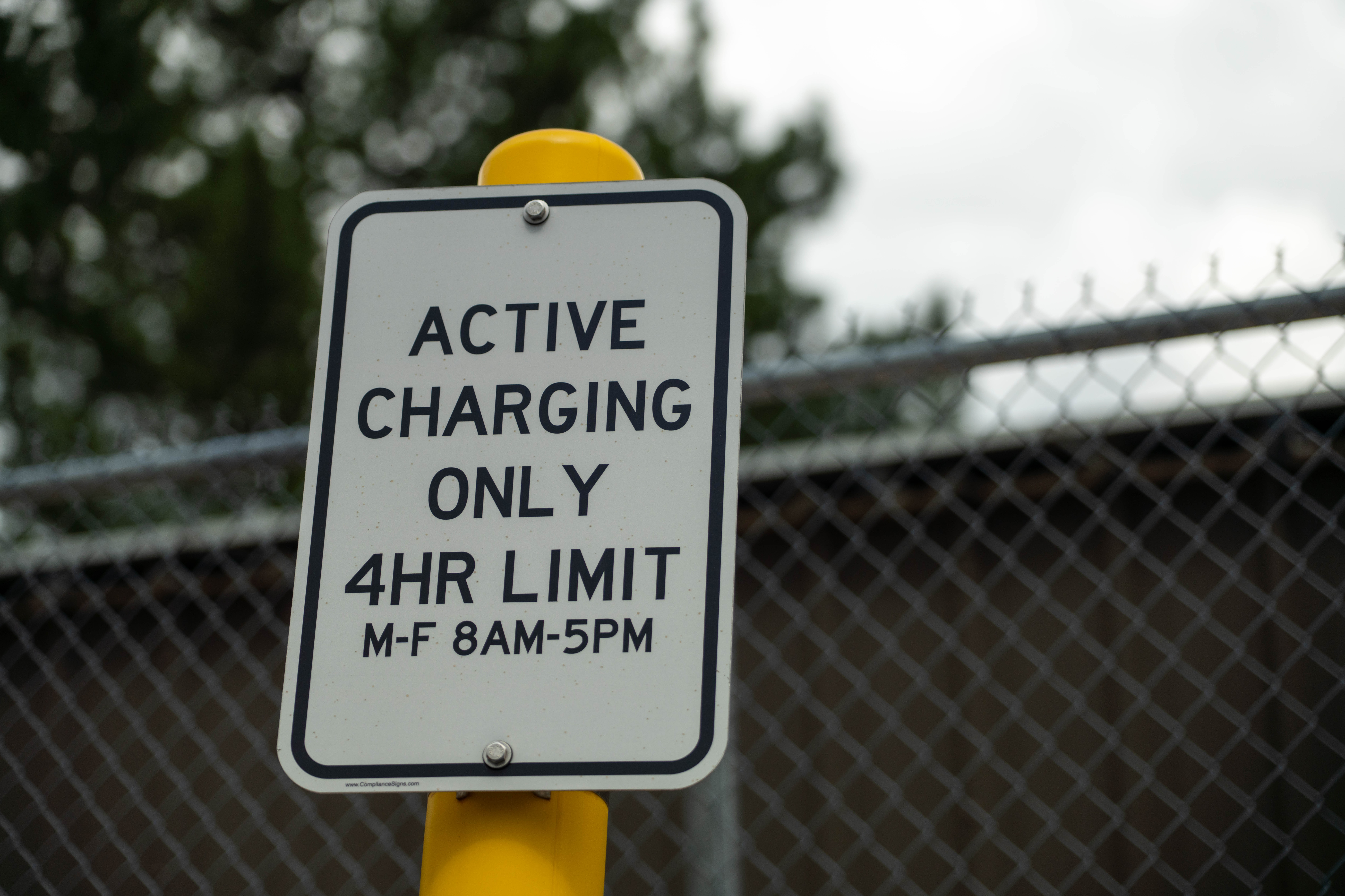A sign reads "Active Charging Only 4 Hour Limit"