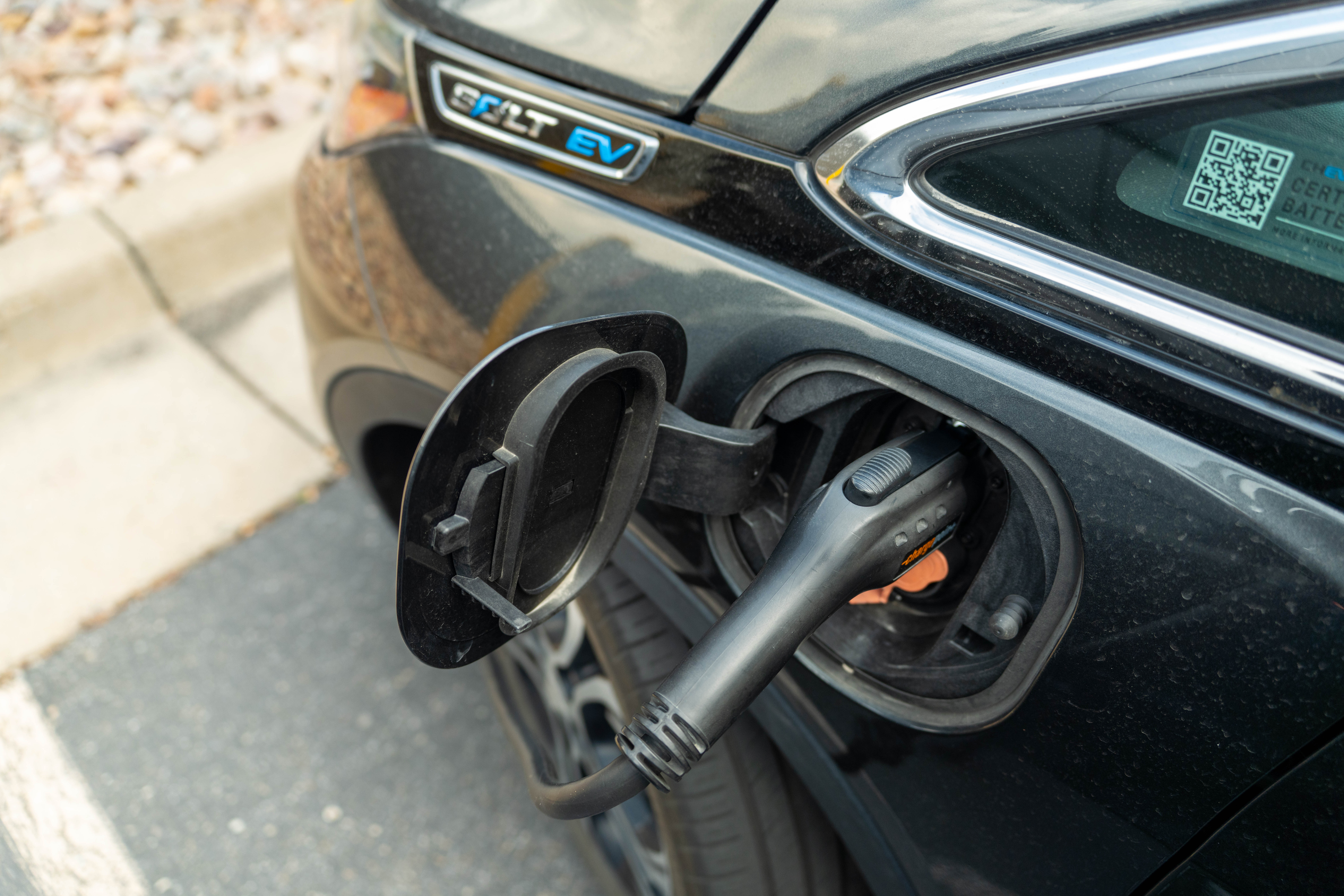 An aerial view of an electric vehicle using a charger