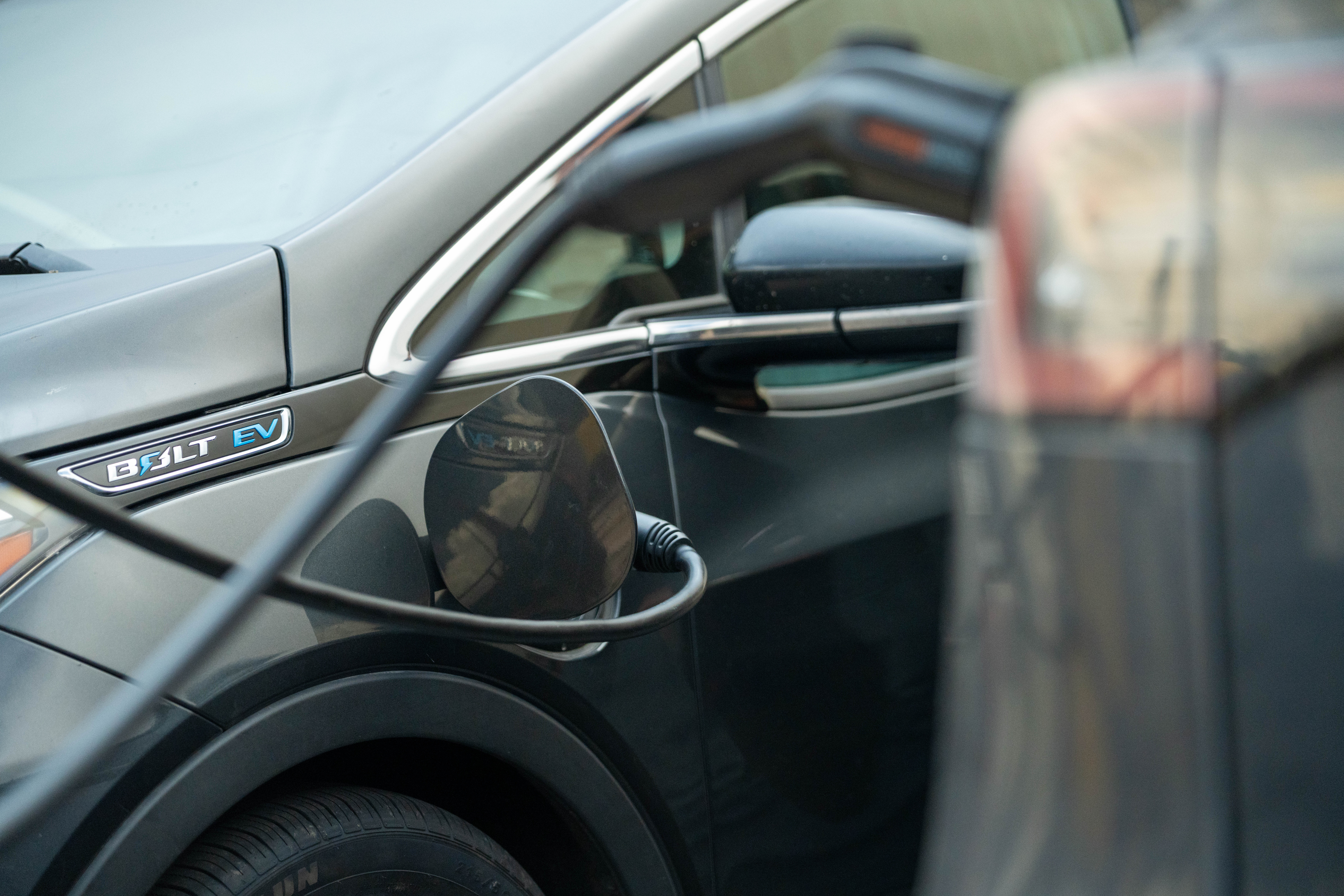 An electric vehicle using a charger
