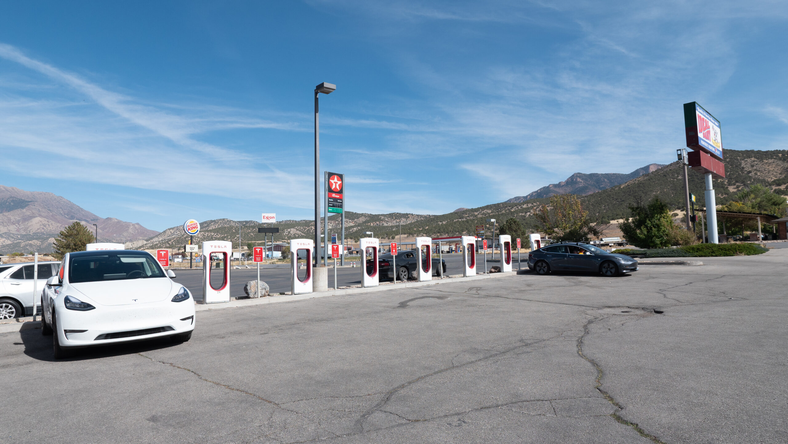 Public EV charging station with mountain backdrop